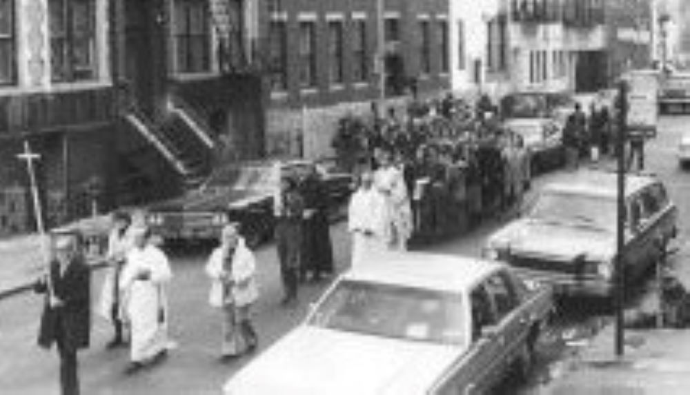 The funeral procession for Dorothy Day makes its way to the Church of the Nativity in New York Dec. 2, 1980. The building, which the Archdiocese of New York sold and decommissioned in 2020, was the parish Day attended. (CNS/Tom Lewis)