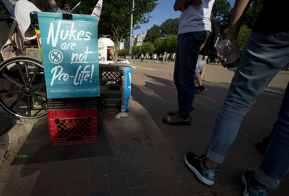 A nuclear war protester demonstrates outside the White House in Washington in 2017. (CNS/Tyler Orsburn)