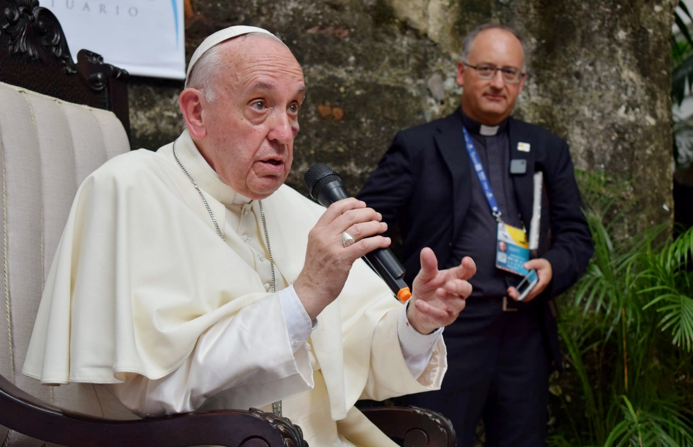 Jesuit Fr. Antonio Spadaro is seen behind Pope Francis during a meeting with Jesuits and laypeople associated with Jesuit institutions in Cartagena, Colombia, Sept. 10. (CNS/Courtesy of La Civiltà Cattolica)