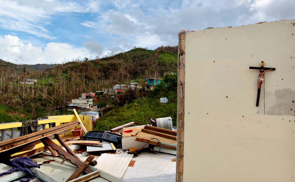 A crucifix hangs on the wall of a destroyed house Oct. 5 in San Lorenzo, Puerto Rico, after Hurricane Maria. (CNS/Reuters/Alvin Baez)