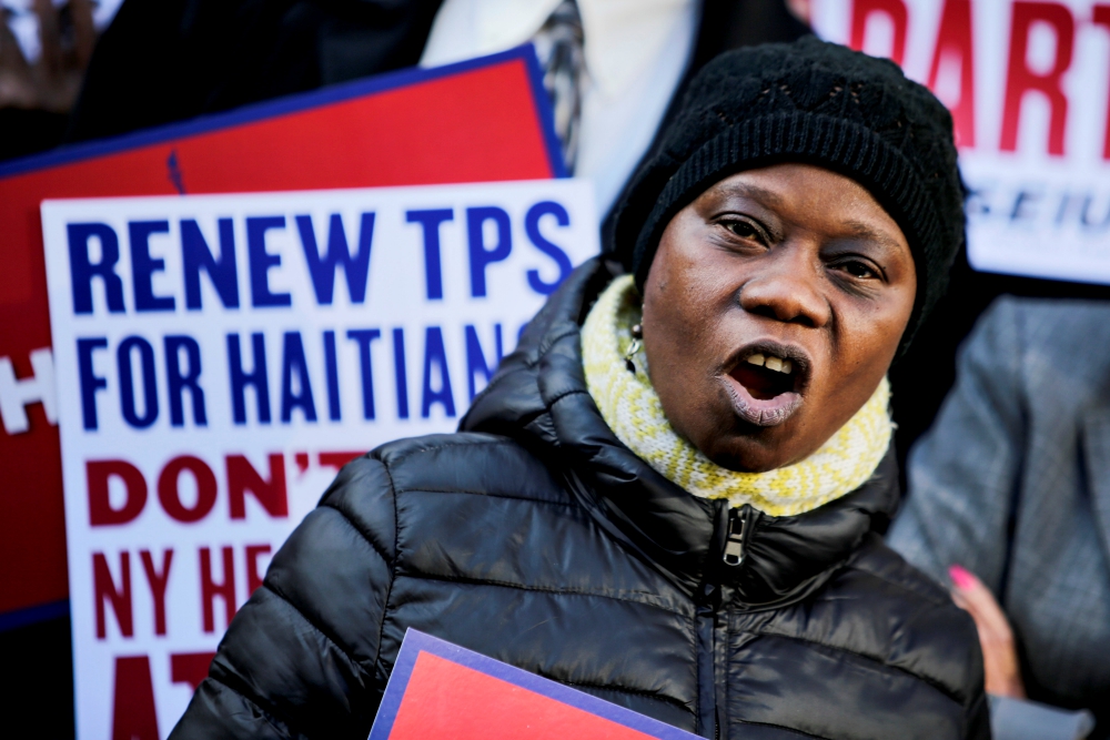 A woman participates in an immigration rally for Haitians Nov. 21 in New York City. (CNS/Reuters/Eduardo Munoz)