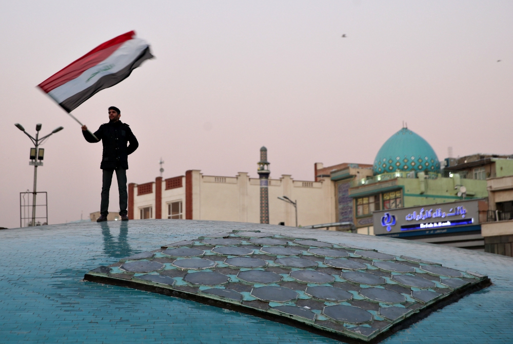 A man celebrates in Tehran, Iran, Jan. 8 after the country launched missiles at U.S.-led forces in Iraq. (CNS/West Asia News Agency via Reuters/Nazanin Tabatabaee) 