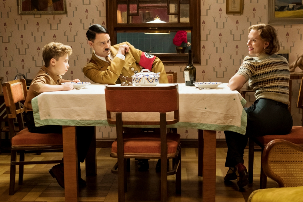 Roman Griffin Davis, Taika Waititi and Scarlett Johansson are seen in the movie "Jojo Rabbit." (CNS/Fox Searchlight)