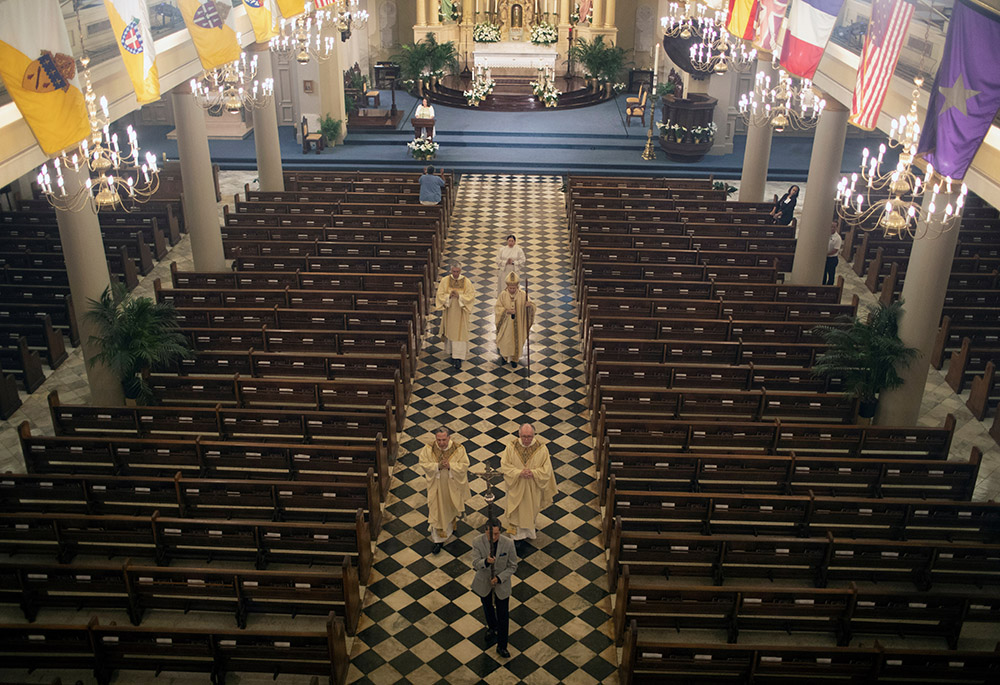 New Orleans Archbishop Gregory Aymond celebrates an Easter Mass which was livestreamed from St. Louis Cathedral St. Louis Cathedral April 12, 2020, during the coronavirus pandemic. The archdiocese filed for Chapter 11 reorganization May 1, 2020. (CNS)