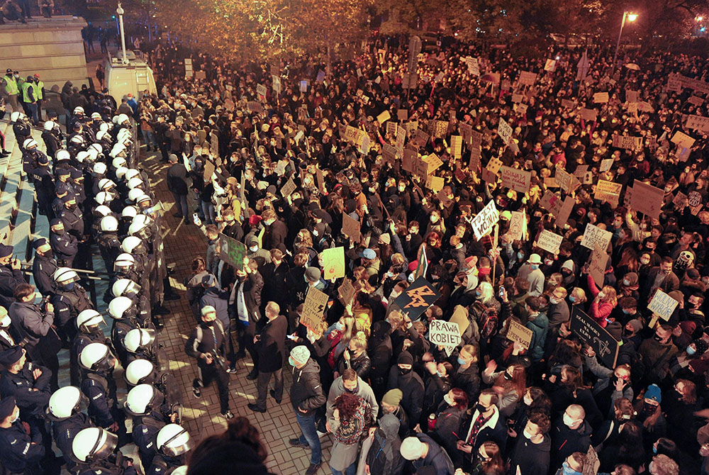 Demonstrators protest Oct. 25, 2020, in front of the Cathedral of Christ the King in Katowice, Poland, against the ruling by Poland's Constitutional Tribunal that imposes a near-total ban on abortion. Many young Polish women protested in November against 