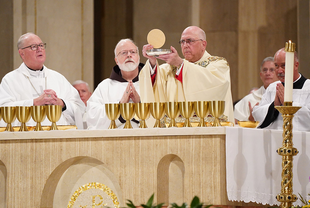 Cardinals Timothy Dolan of New York, left, Sean O'Malley of Boston, and Archbishop Joseph Naumann of Kansas City, Kansas, concelebrate the opening Mass of the National Prayer Vigil for Life Jan. 23, 2020, at the Basilica of the National Shrine of the Imma