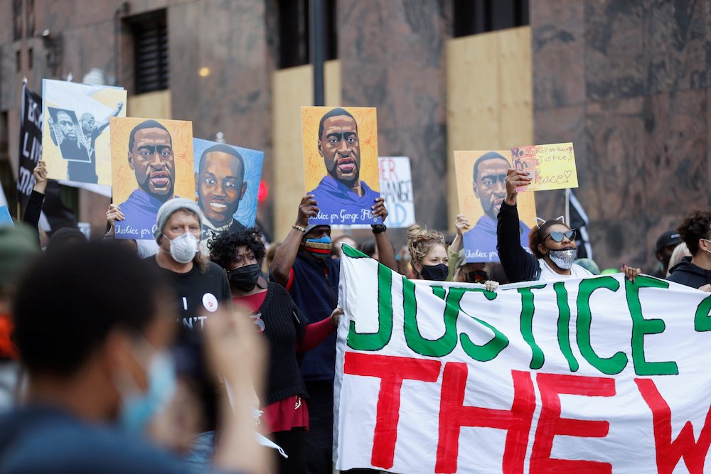 Demonstrators in Minneapolis march on the first day of the trial of former police officer Derek Chauvin March 29. (CNS/Reuters/Octavio Jones)