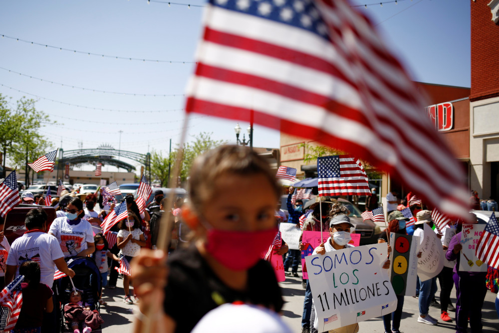 Members of the Border Network for Human Rights and the Reform Immigration Alliance for Texas hold a march in El Paso, Texas, April 10.