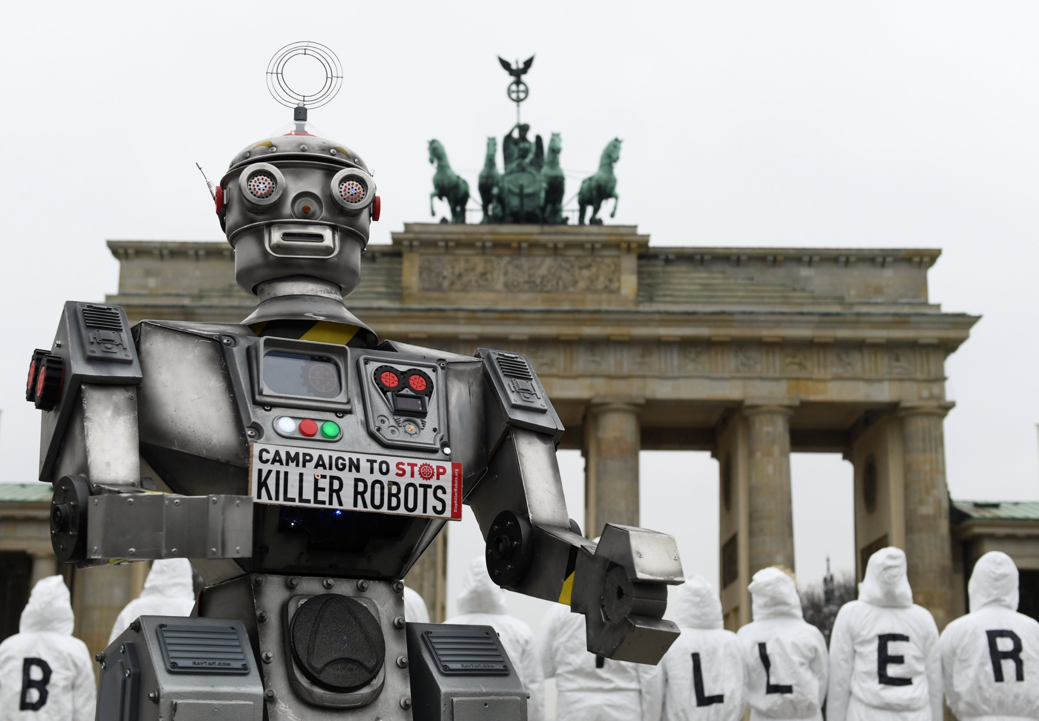 Activists from the Campaign to Stop Killer Robots, a coalition of nongovernmental organizations opposing lethal autonomous weapons, protest at the Brandenburg Gate in Berlin March, 21, 2019. (CNS photo/Annegret Hilse, Reuters)