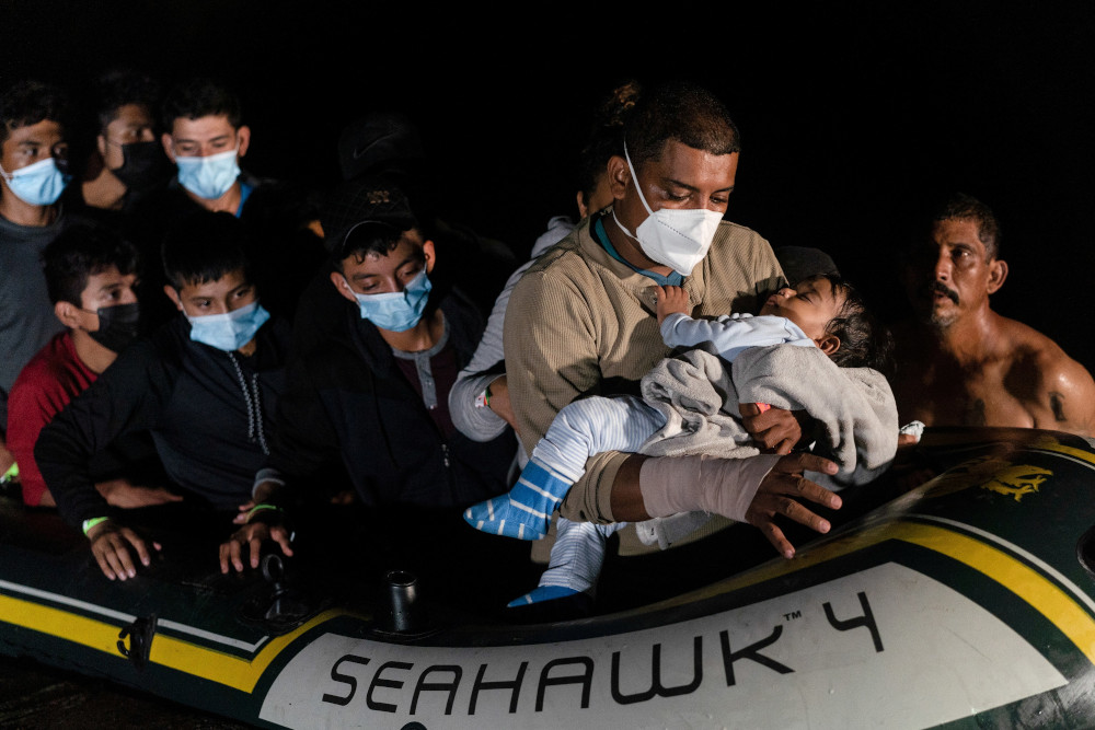 Migrant families arrive Aug. 14 in Roma, Texas, after crossing the Rio Grande from Mexico amid the coronavirus pandemic. (CNS/Reuters/Go Nakamura)