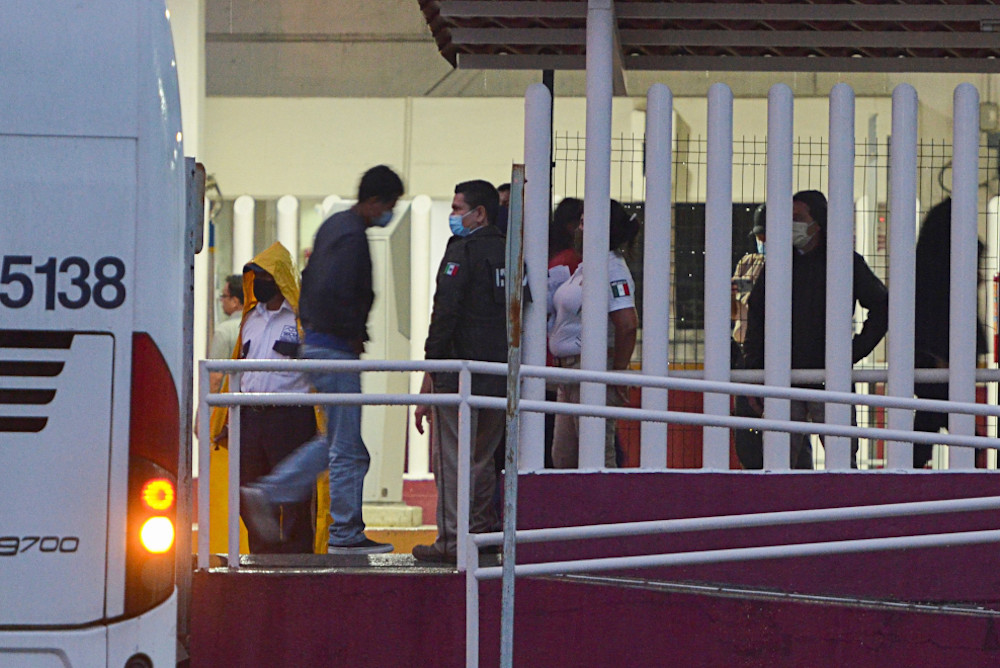 Asylum-seekers deported from the U.S. under Title 42 get off a bus at a migration facility Aug. 9 in Tapachula, Mexico. (CNS/Reuters/Jose Torres)