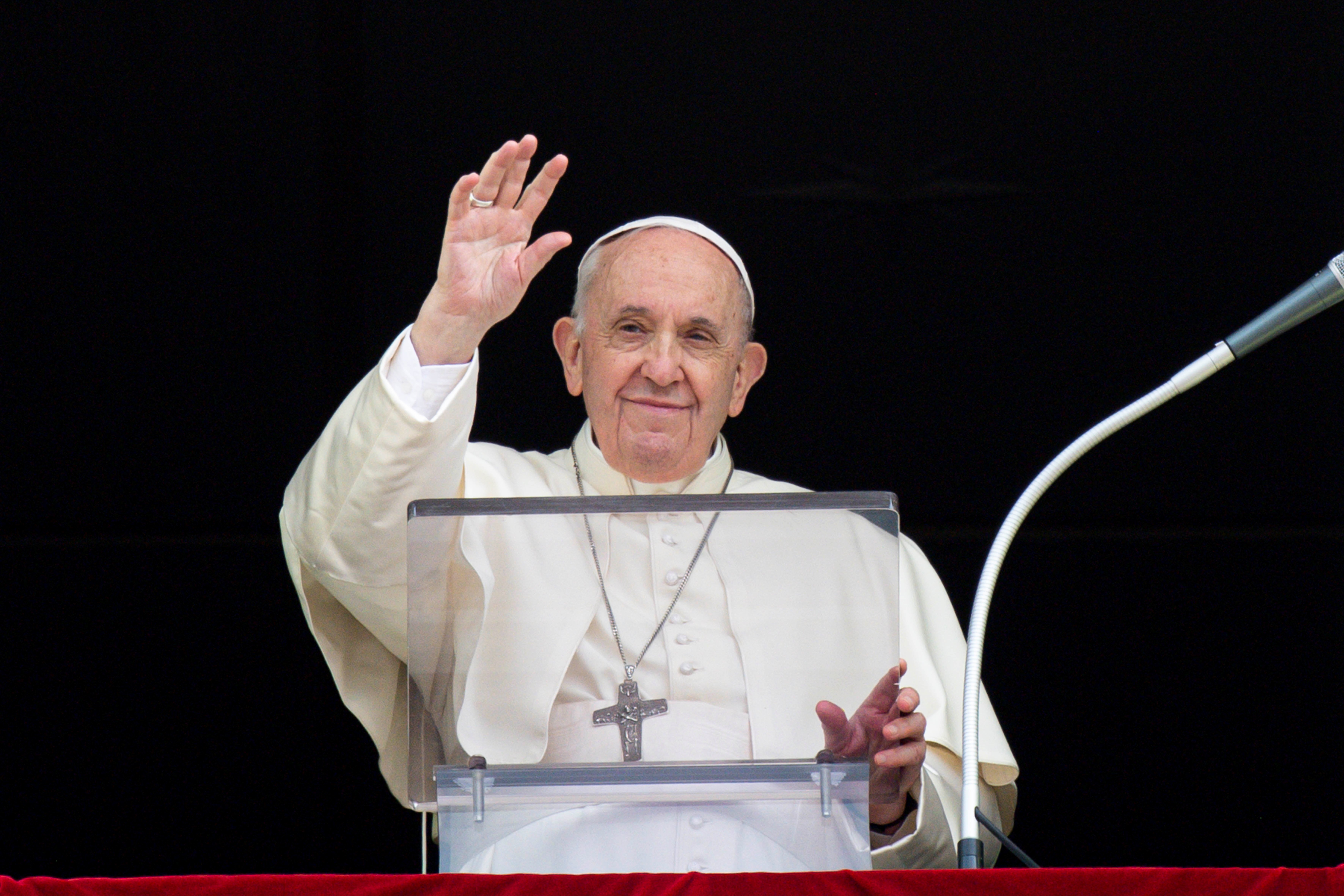 Pope Francis greets the crowd as he leads the Angelus from the window of his studio overlooking St. Peter's Square at the Vatican Sept. 26, 2021. (CNS photo/Vatican Media)