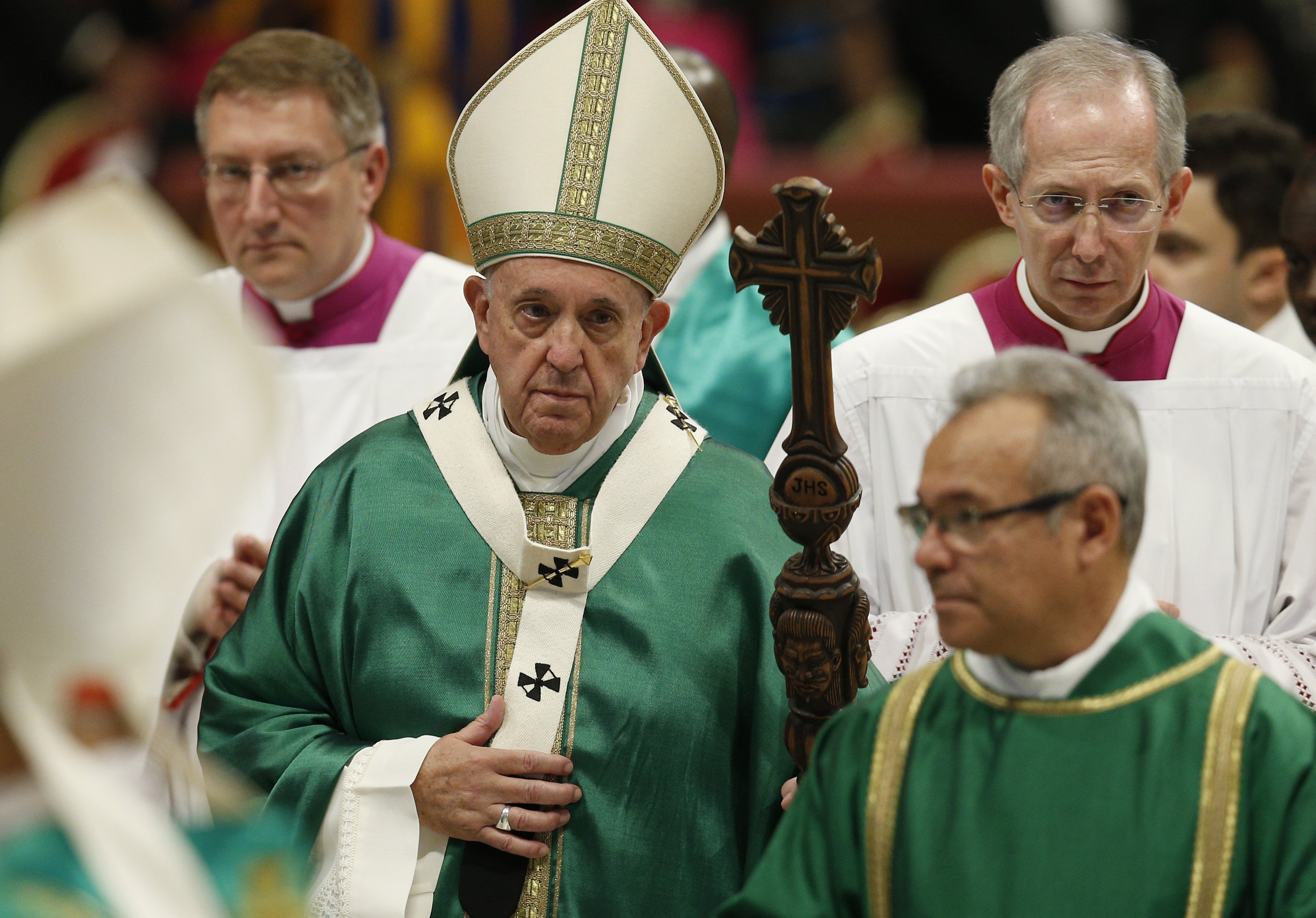 Pope Francis carries his pastoral staff as he leaves the concluding Mass of the Synod of Bishops for the Amazon at the Vatican Oct. 27, 2019. The pope plans to celebrate a Mass Oct. 10, 2021, to formally open the synodal process for the Synod of Bishops i