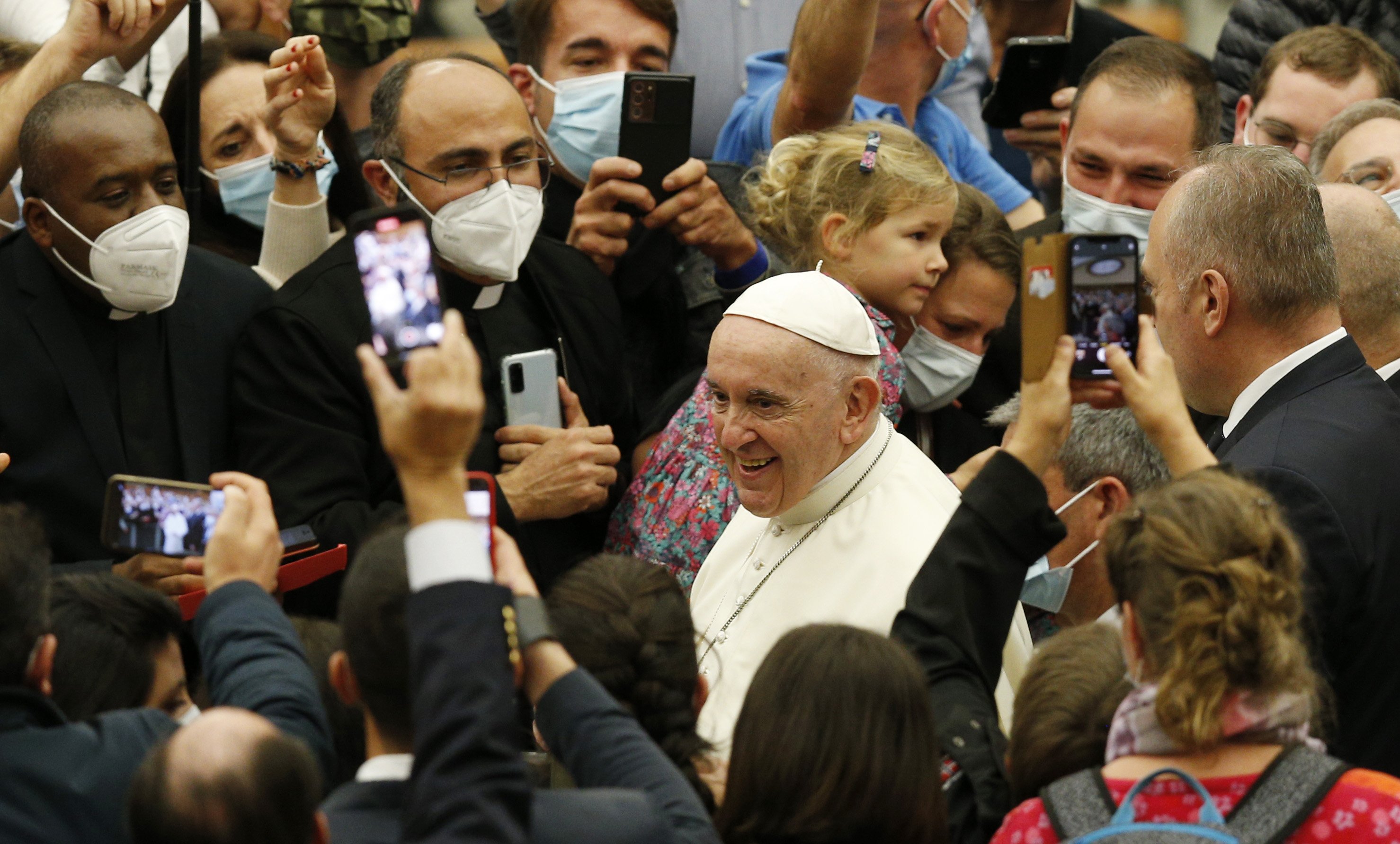 Pope Francis greets the crowd as he leaves his general audience in the Paul VI hall at the Vatican Nov. 10, 2021. (CNS photo/Paul Haring)