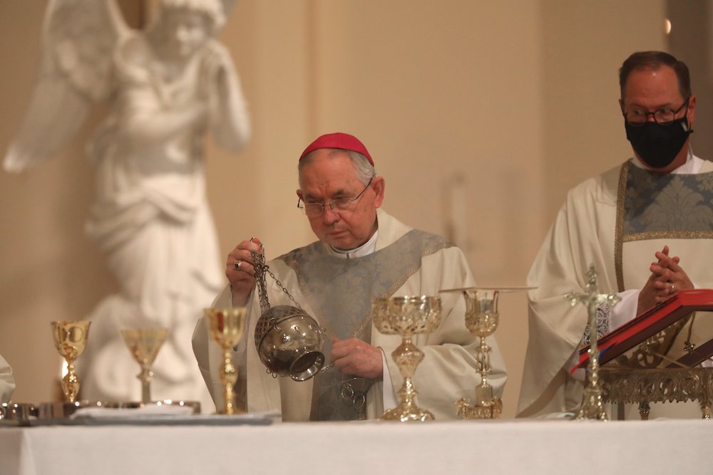 Archbishop José Gomez of Los Angeles swings a censer as he concelebrates Mass at the Basilica of the National Shrine of the Assumption of the Blessed Virgin Mary Nov. 15, 2021, in Baltimore during the bishops' fall general assembly. (CNS/Bob Roller)