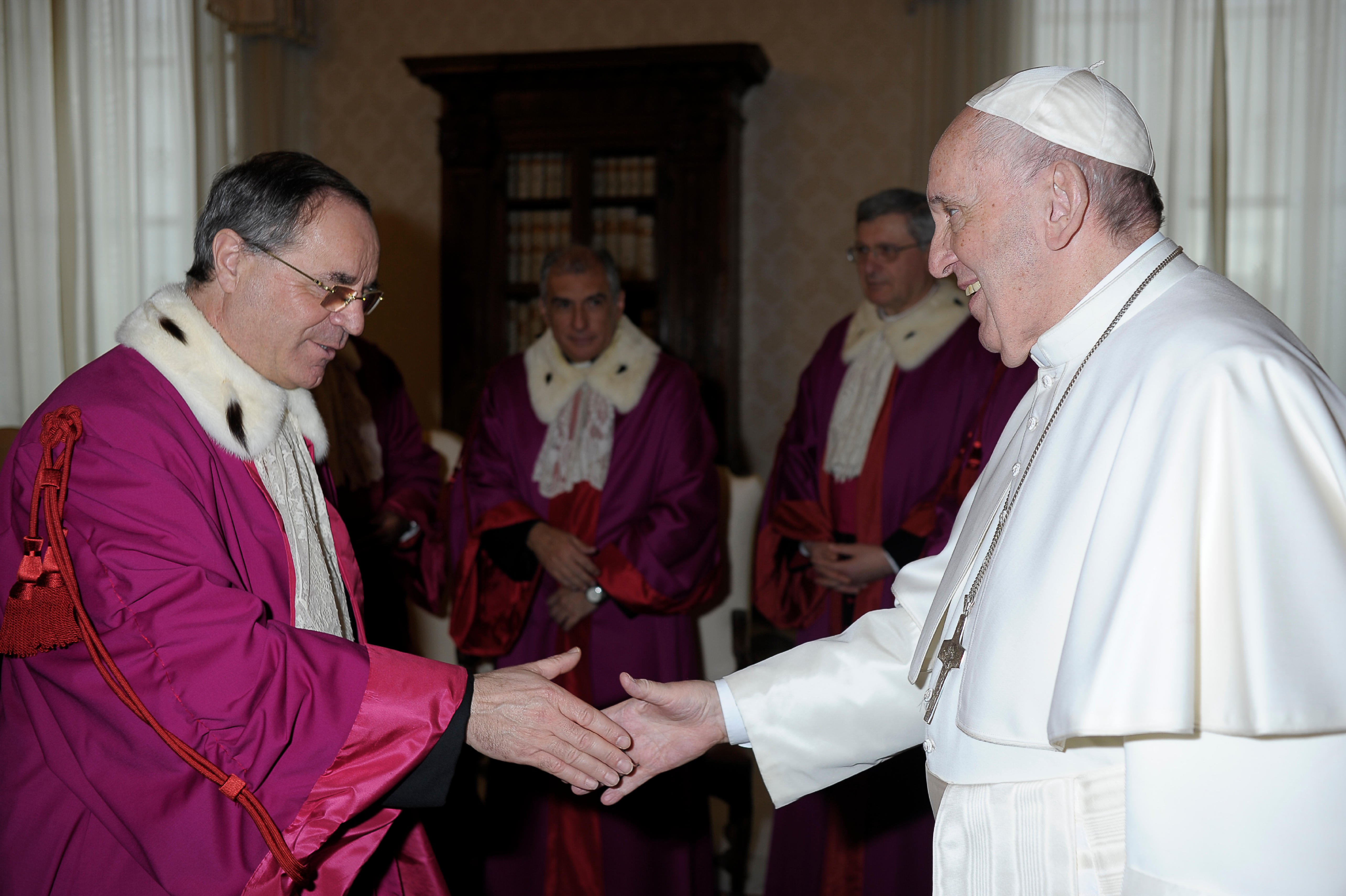 Vatican Judge Venerando Marano listens as the president of the Vatican City State tribunal, Giuseppe Pignatone, speaks during the third session of the trial of six defendants accused of financial crimes, including Cardinal Angelo Becciu, at the Vatican Ci