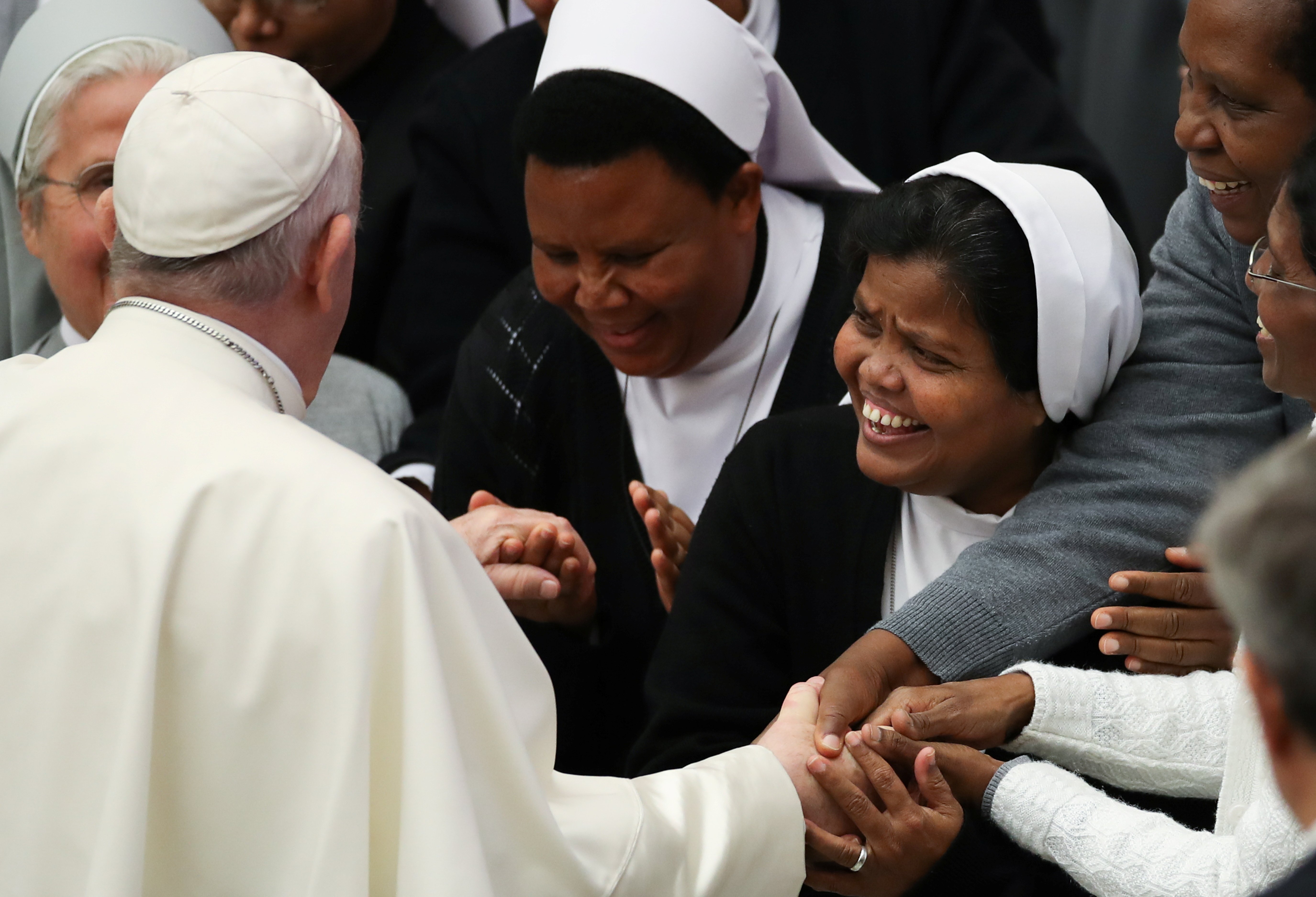 Pope Francis greets a group of nuns after his general audience in Paul VI hall at the Vatican Dec. 1, 2021. (CNS photo/Yara Nardi, Reuters)