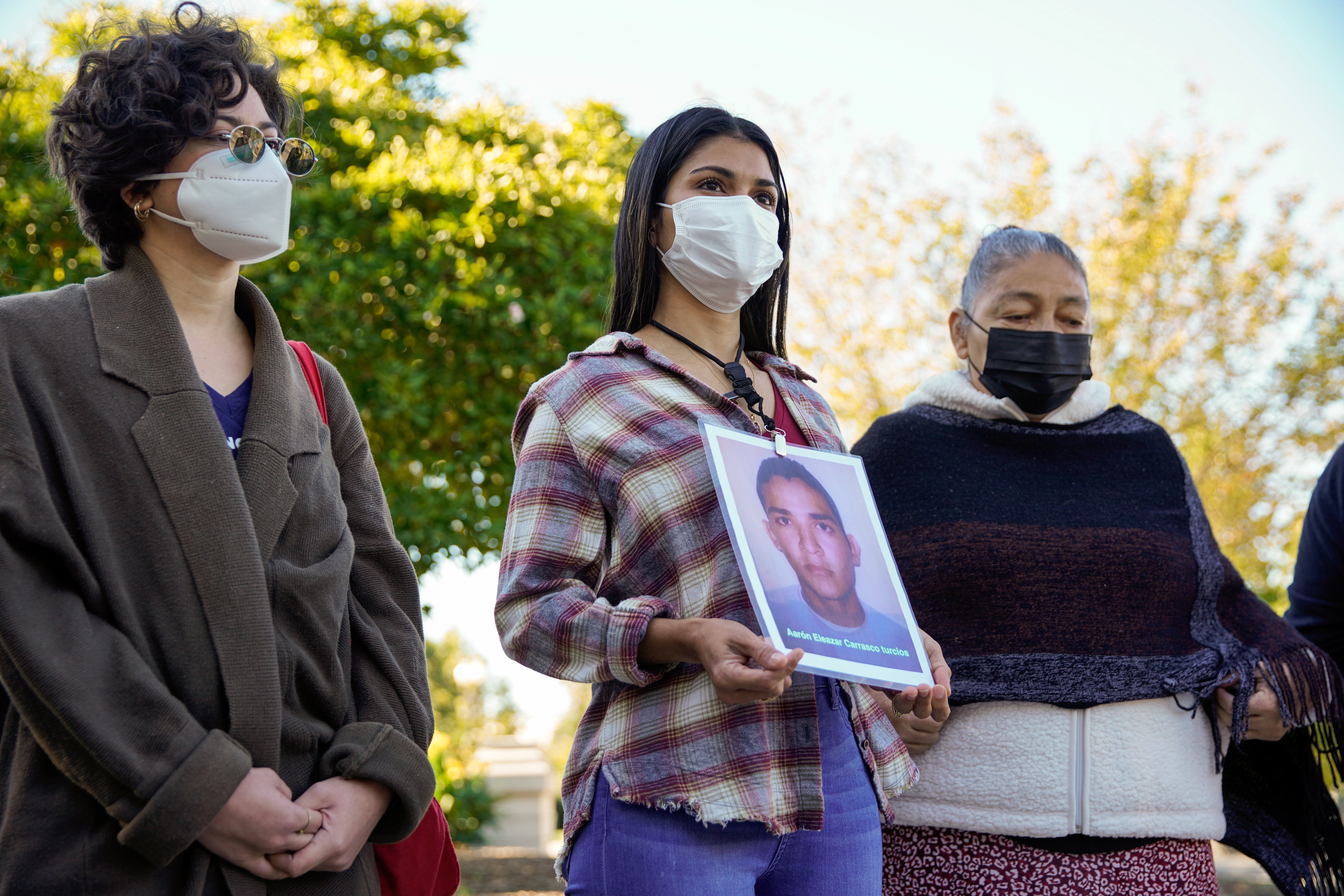 Karen Morales of Honduras talks about her brother, Aaron Eleazar Carrasco Turcios, who went missing nine years ago in Mexico, while standing with other women with the Caravan of Mothers of Disappeared Migrants on Capitol Hill in Washington Oct. 19, 2021. 