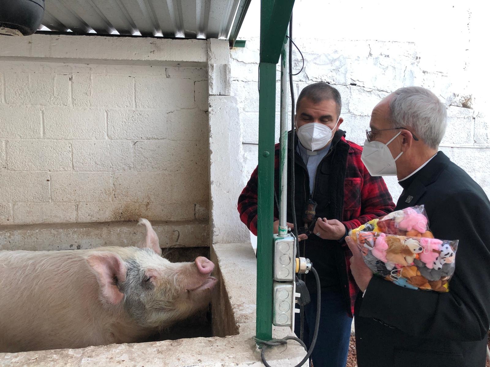 Bishop Mark J. Seitz of El Paso, Texas, visits a facility Dec. 10, 2021, that is run by a Christian pastor who helps migrants in the border city of Ciudad Juarez, Mexico. Bishop Seitz is chairman-elect of the U.S. Conference of Catholic Bishops' migration