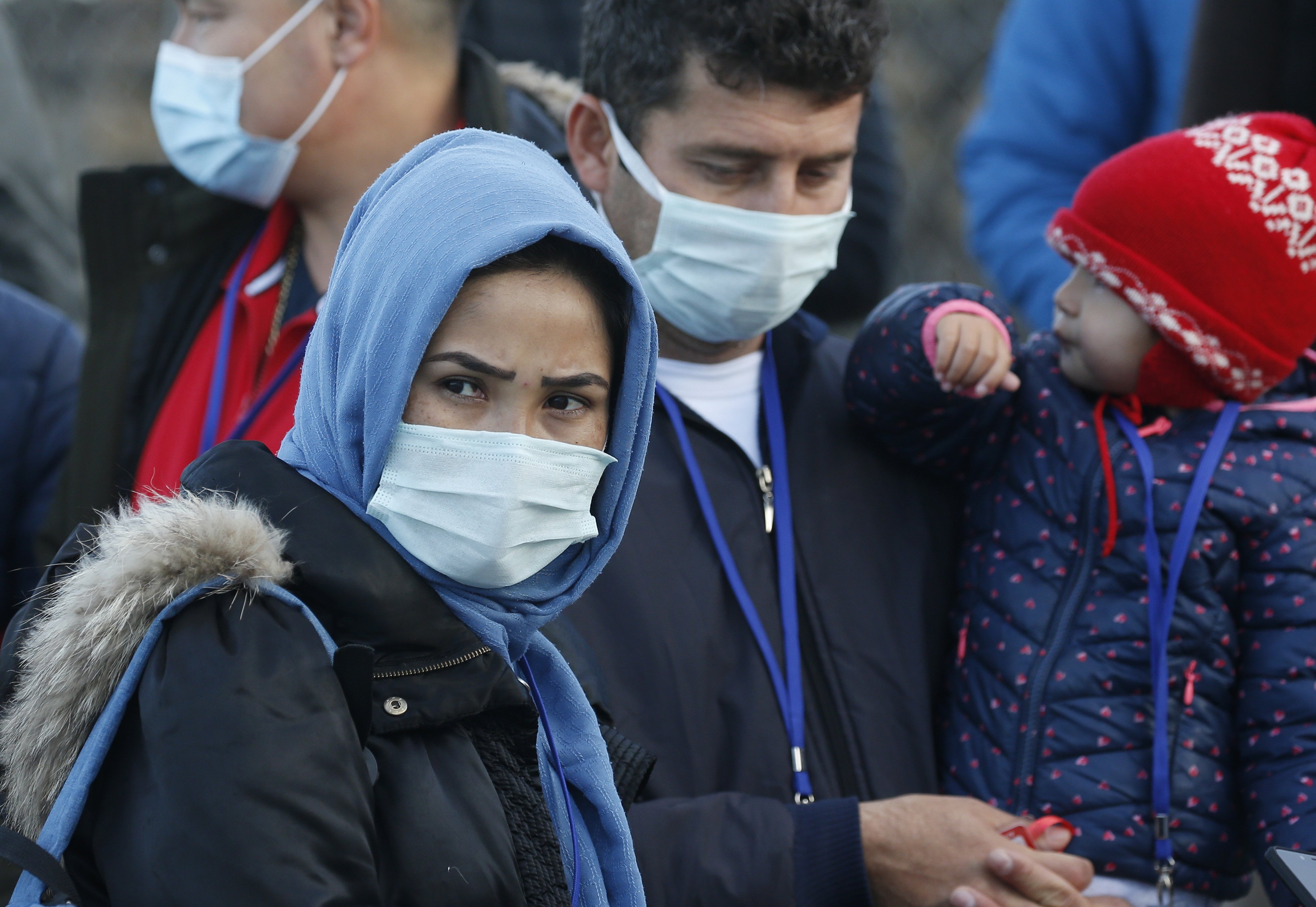 Family members wait to enter an event with Pope Francis at the government-run Reception and Identification Center for refugees in Mytilene, Greece, Dec. 5, 2021. (CNS photo/Paul Haring)