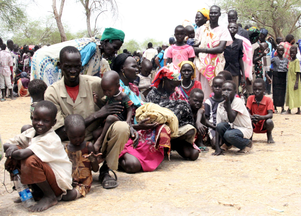 Displaced South Sudanese are pictured in a file photo waiting at a World Food Program outpost where thousands have taken shelter in Malakal, South Sudan. (CNS photo/Denis Dumo, Reuters)