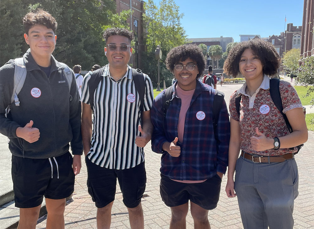 Students at Loyola University New Orleans show their support for food service workers' right to organize by sporting pro-union stickers. (Courtesy of Unite Here)