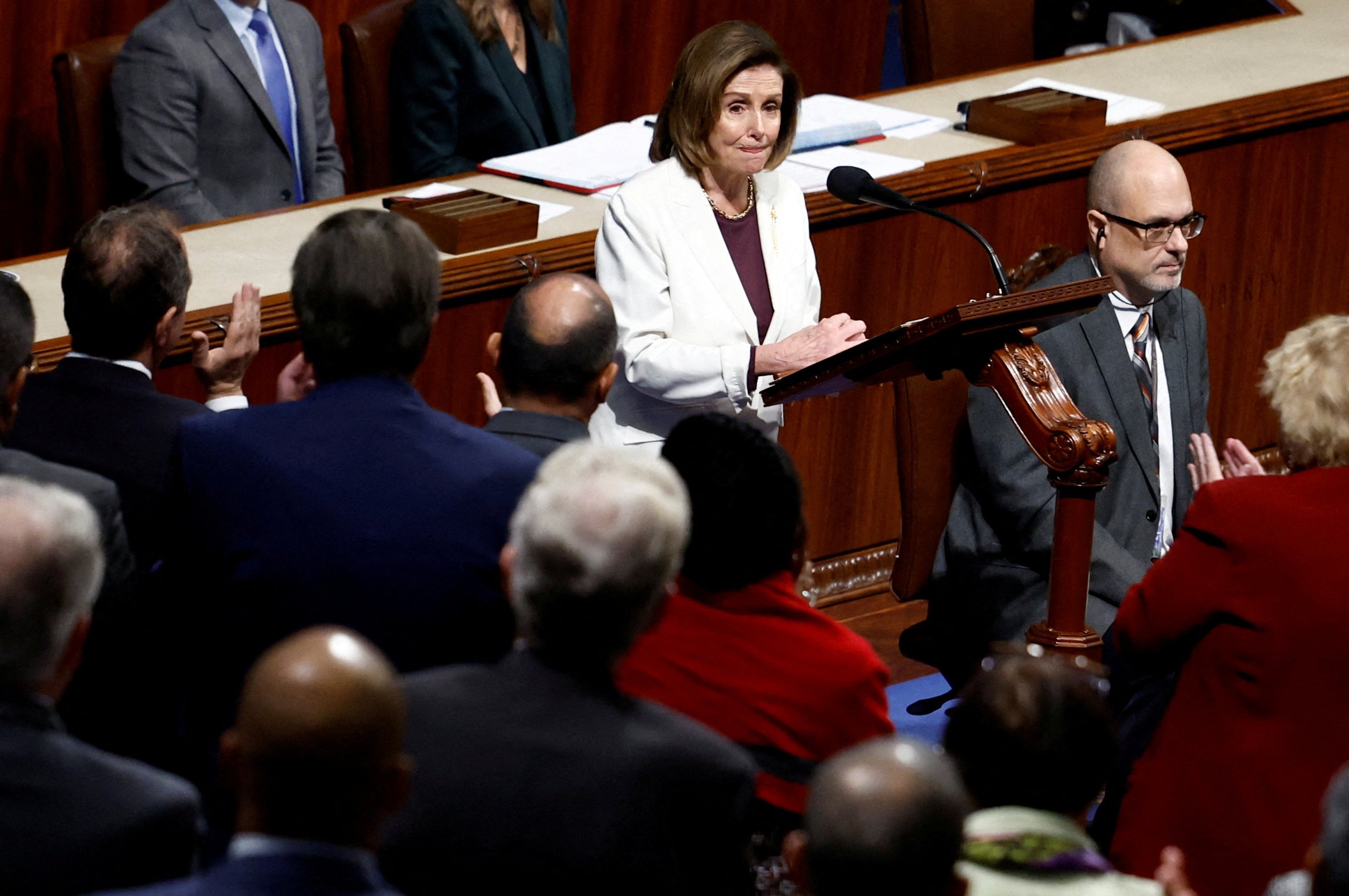 House Speaker Nancy Pelosi, D-Calif., speaks at a podium. 