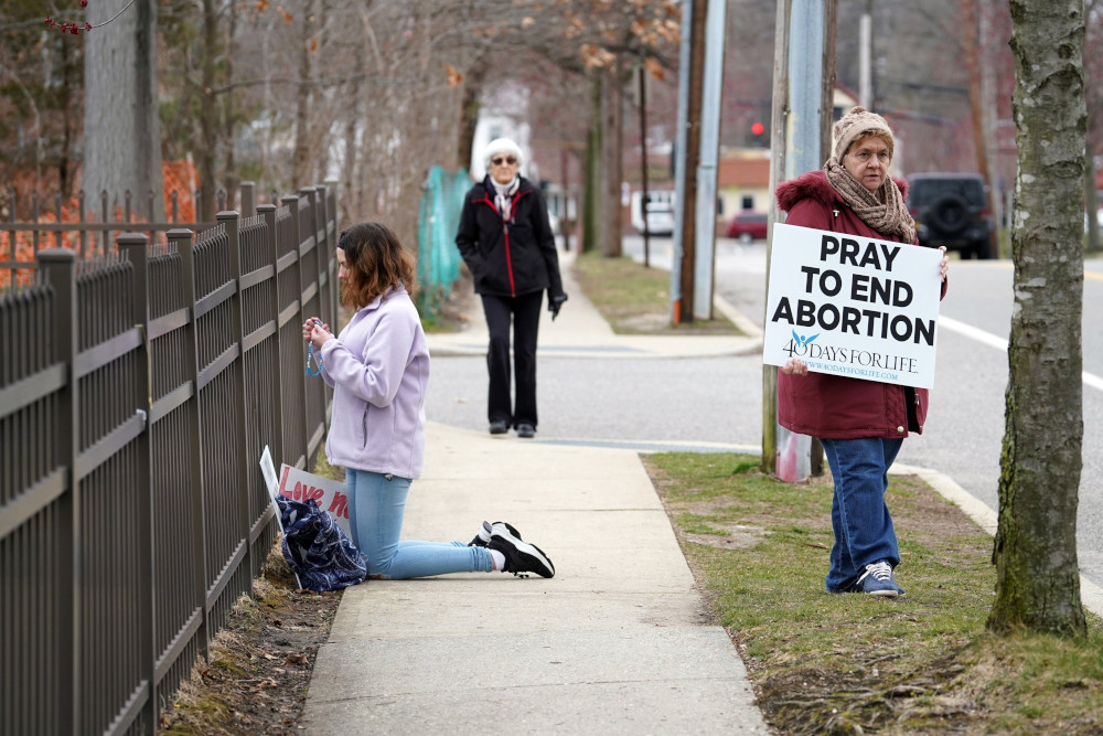 Pro-life advocates participate in a 40 Days for Life vigil near the entrance to a Planned Parenthood center in Smithtown, N.Y., March 19, 2020. (CNS photo/Gregory A. Shemitz)