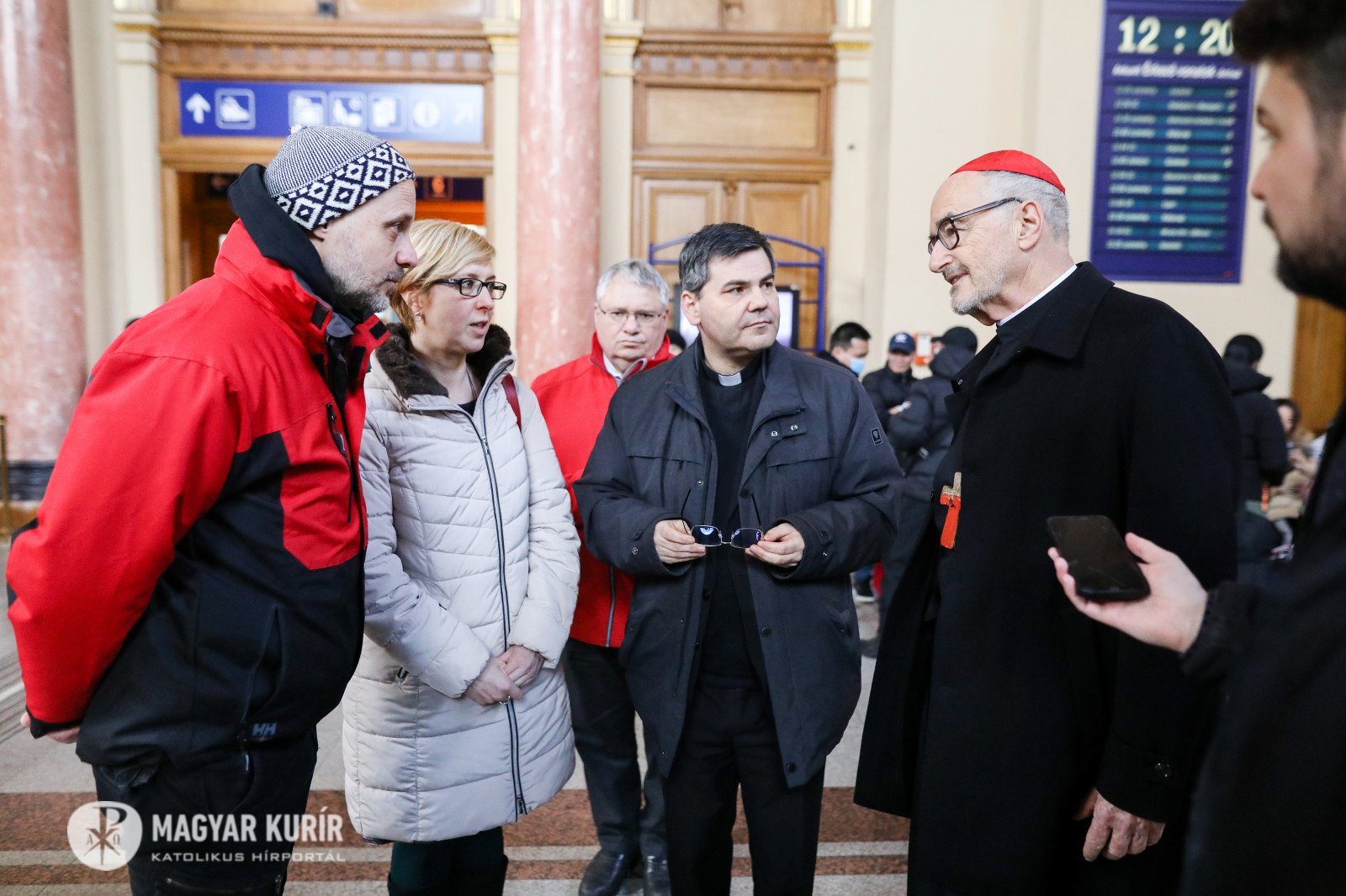 Canadian Cardinal Michael Czerny, interim president of the Dicastery for Promoting Integral Human Development, talks with people during a visit to meet with Ukrainian refugees arriving at the Keleti train station in Budapest, Hungary, March 8, 2022. (CNS 