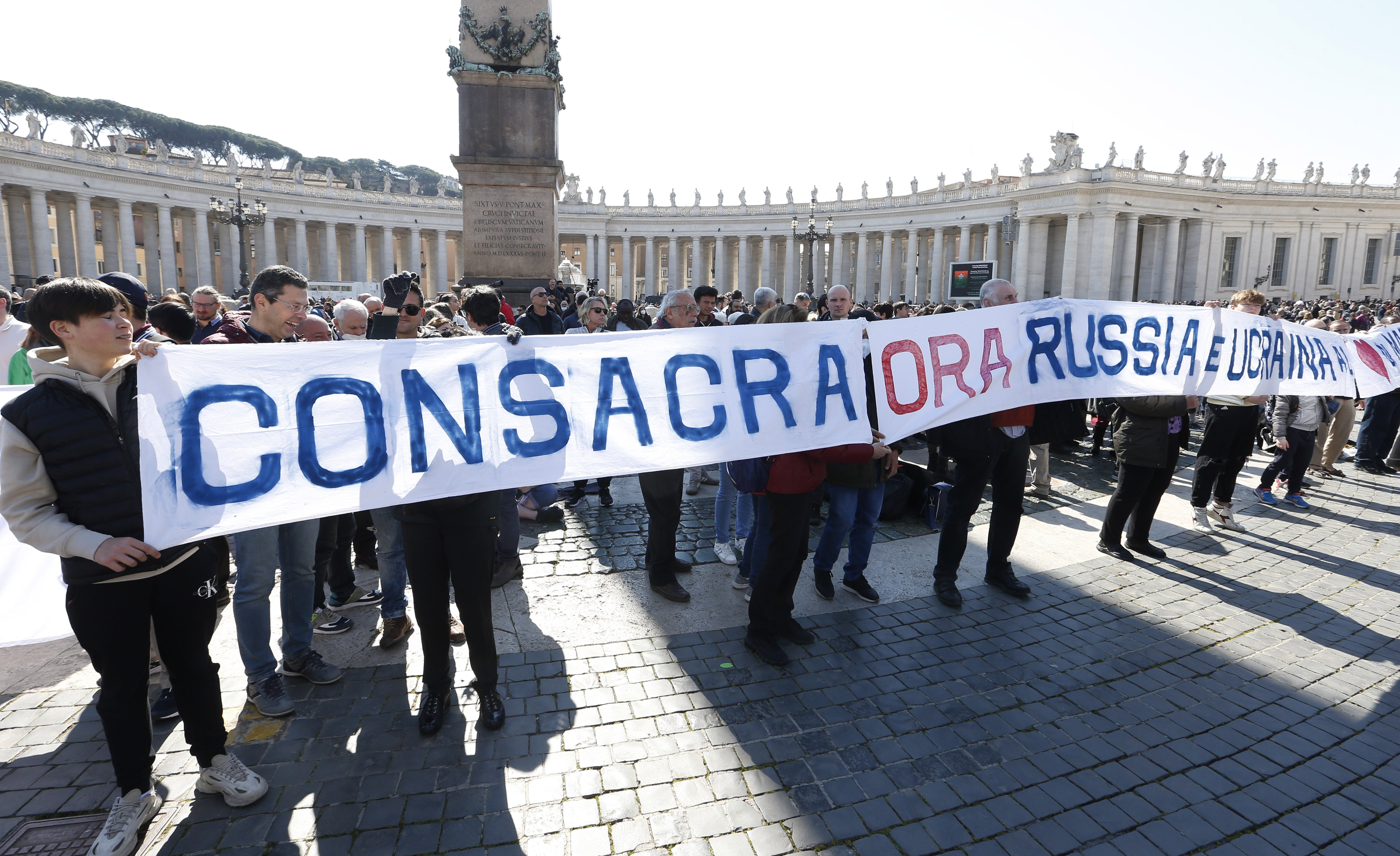 A sign in St. Peter's Square calls for the consecration of Russia and Ukraine to Mary, before the start of Pope Francis' Angelus at the Vatican March 13, 2022. (CNS photo/Paul Haring)