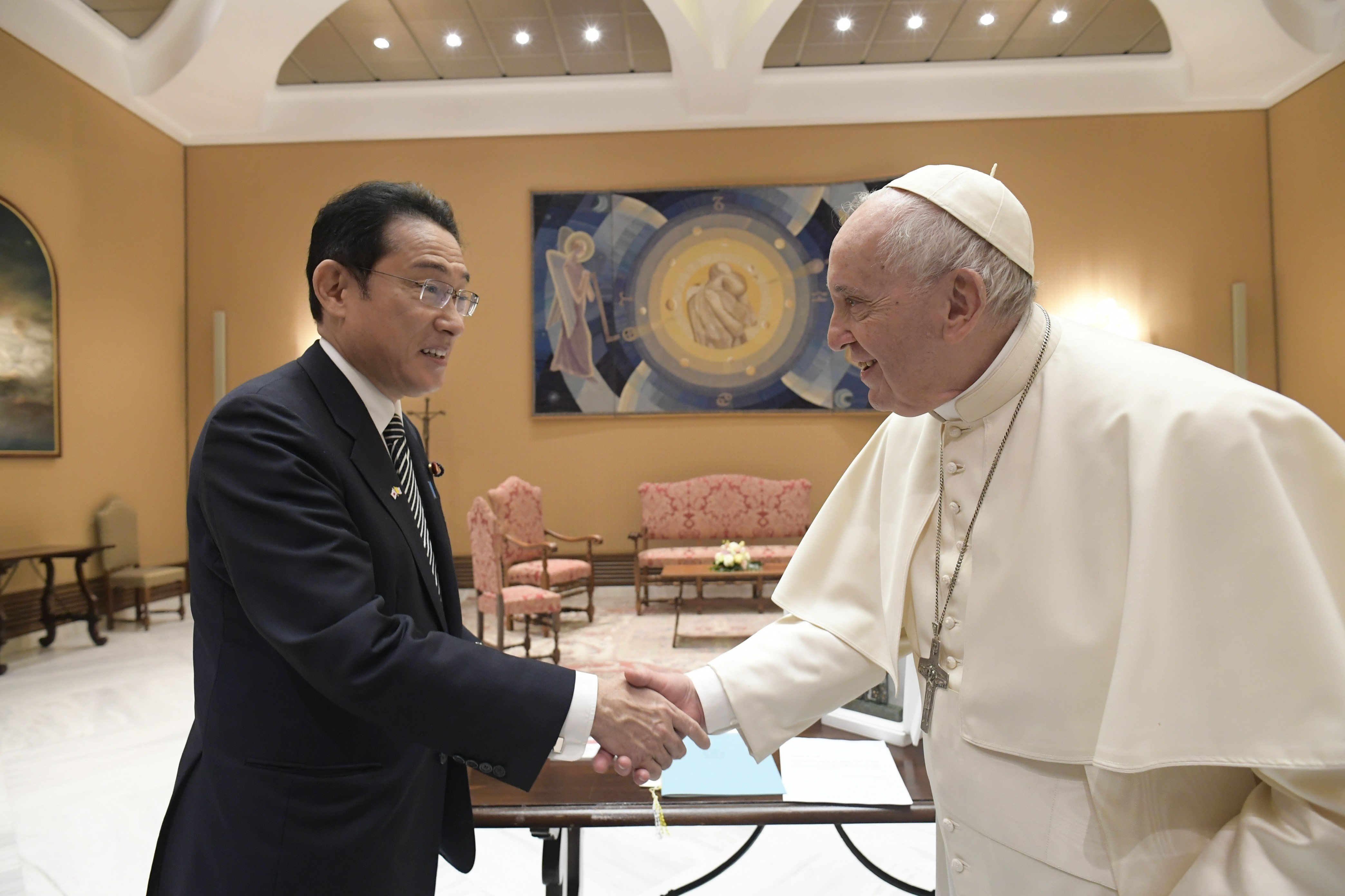 Pope Francis shakes hands with Japanese Prime Minister Fumio Kishida during a private audience at the Vatican May 4, 2022. (CNS photo/Vatican Media)