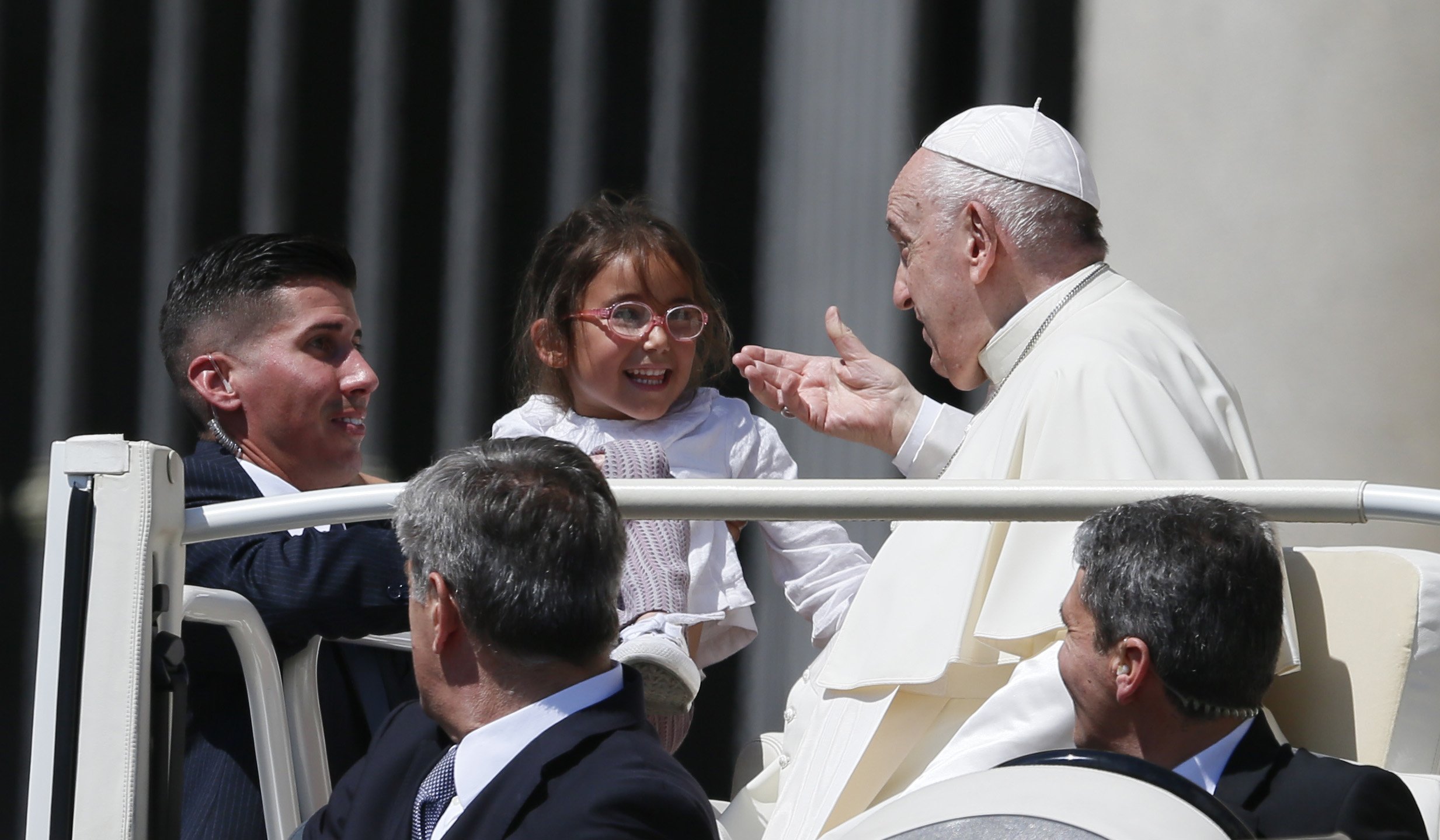 Pope Francis greets a child during his general audience in St. Peter's Square at the Vatican May 18, 2022. (CNS photo/Paul Haring)