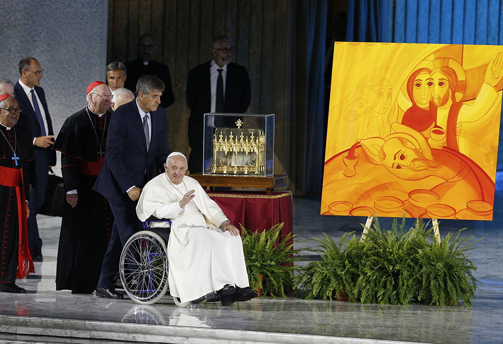 Pope Francis arrives to open the World Meeting of Families in the Paul VI hall June 22 at the Vatican. (CNS/Paul Haring)