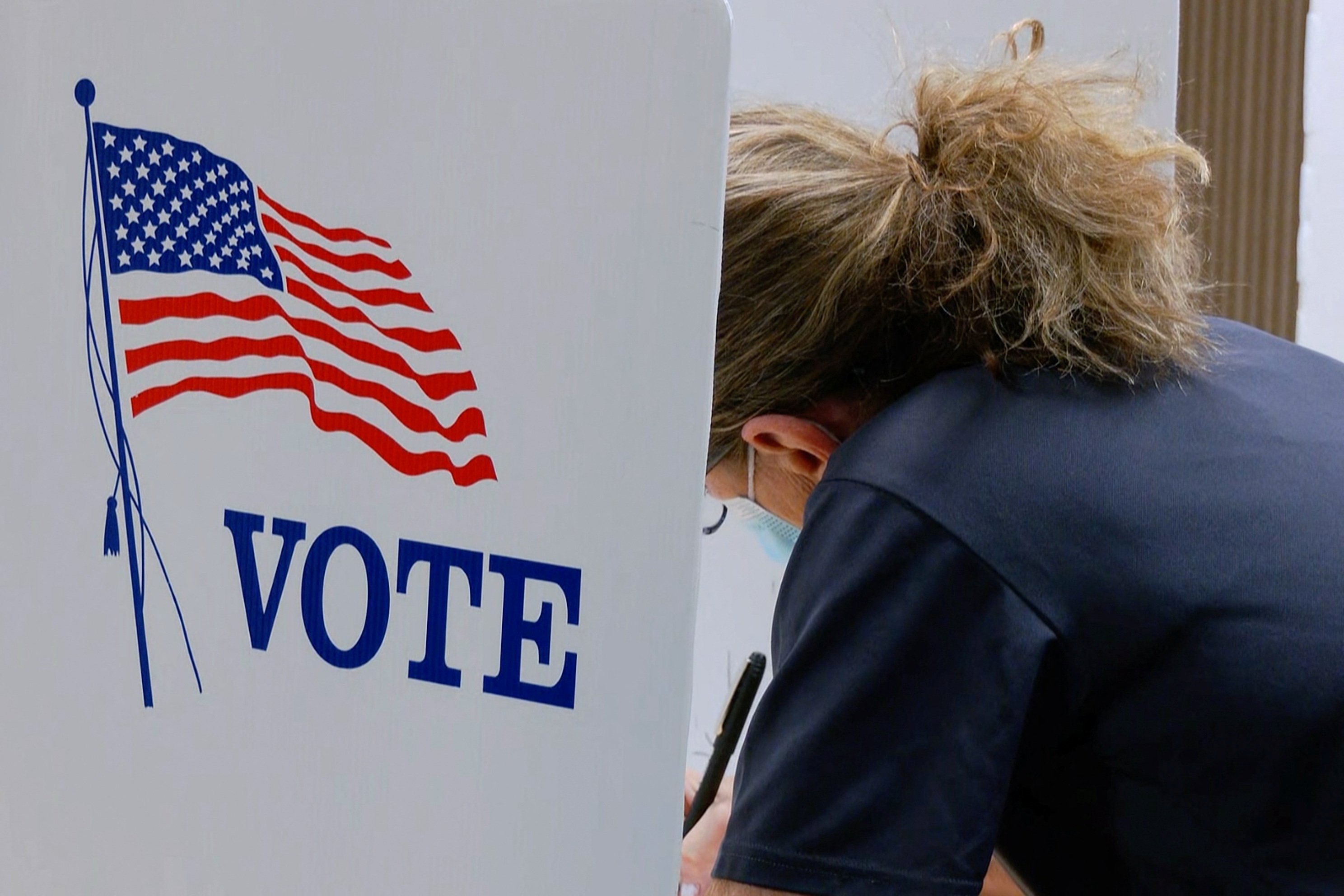 A voter marks a ballot during the primary election and abortion referendum in Kansas City, Kansas, August 2. Voters rejected a ballot referendum that would have added language to the state constitution to say there is no constitutional right to abortion i