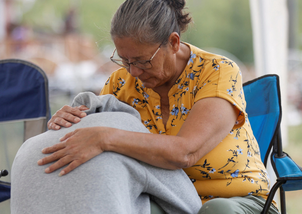 Annie Sanderson comforts her granddaughter Sept. 5, 2022, after a stabbing spree left at least 11 people in the James Smith First Nation and in the nearby town of Weldon, Saskatchewan.