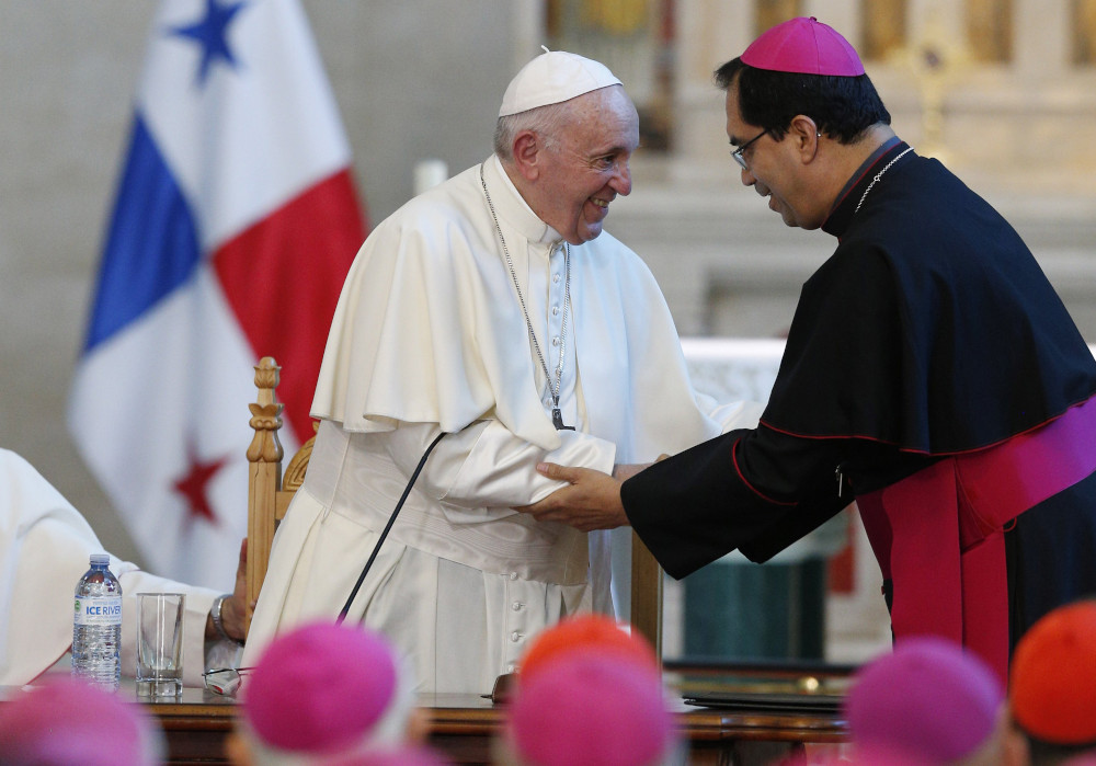 Pope Francis greets Salvadoran Archbishop José Escobar Alas of San Salvador in Panama City Jan. 24, 2019. (CNS photo/Paul Haring)