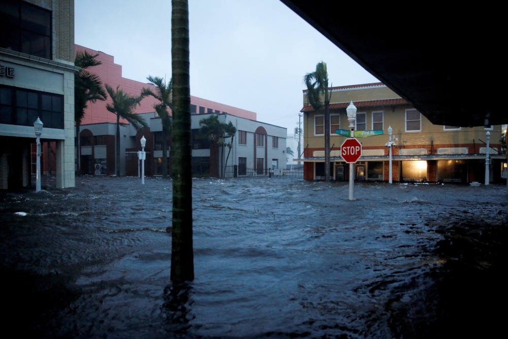 Floodwaters cover a road after Hurricane Ian made landfall in Fort Myers, Fla., Sept. 28, 2022. (CNS photo/Marco Bello, Reuters)