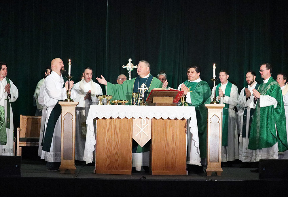 Bishop Richard Stika of Knoxville, Tennessee, celebrates the Feb. 6, 2022, closing Mass for SEEK22 in the ballroom of the Knoxville Convention Center. More than 1,000 participants from 15 campuses in five states attended the Feb. 4-6 Fellowship of Catholic University Students conference. (CNS/The East Tennessee Catholic/Gabrielle Nolan)