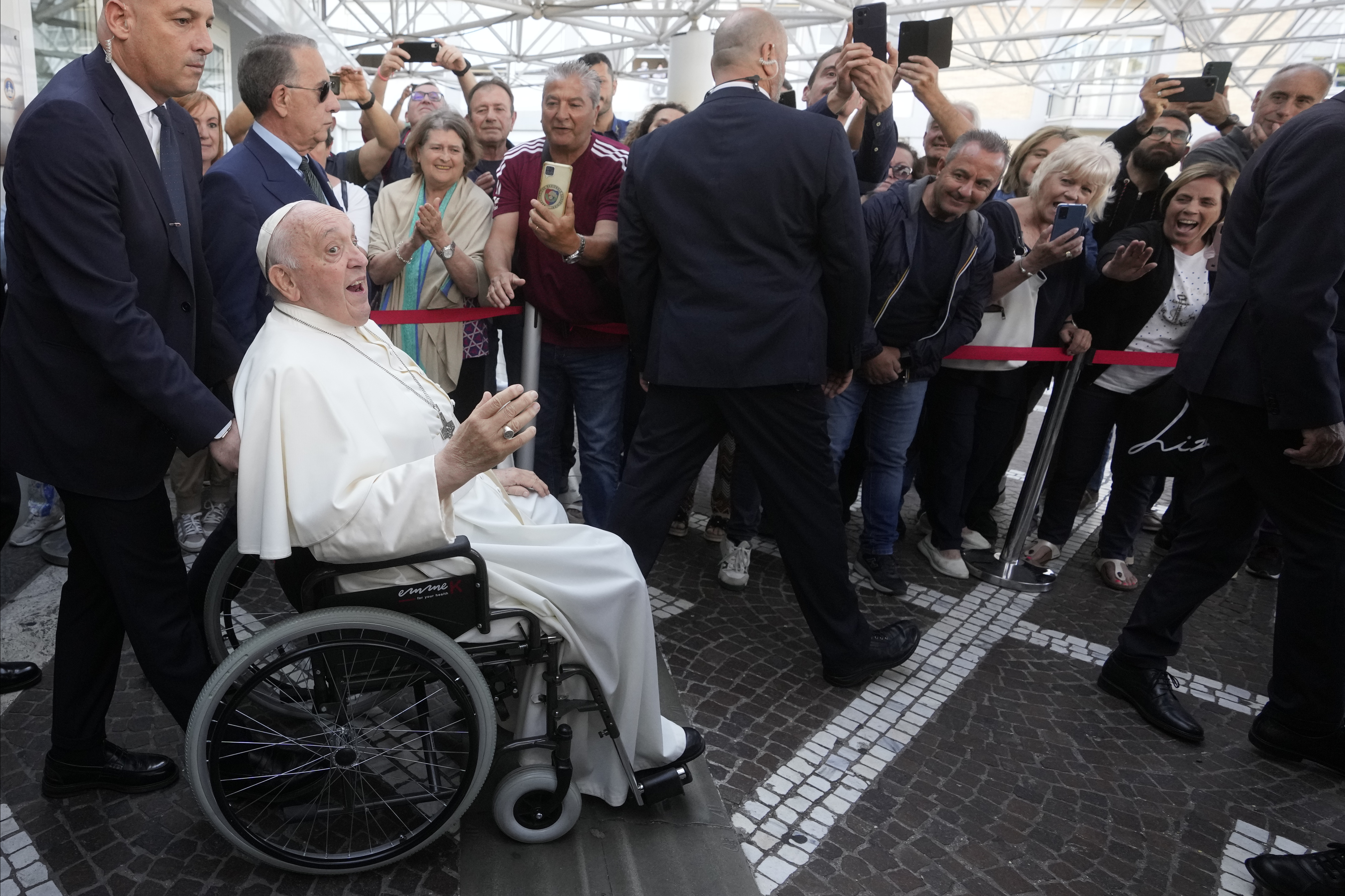 Pope Francis leaves the Agostino Gemelli University Polyclinic in Rome, Friday, June 16, 2023, nine days after undergoing abdominal surgery. The 86-year-old pope was admitted to Gemelli hospital on June 7 for surgery to repair a hernia in his abdominal wall and remove intestinal scar tissue that had caused intestinal blockages. (AP Photo/Andrew Medichini)