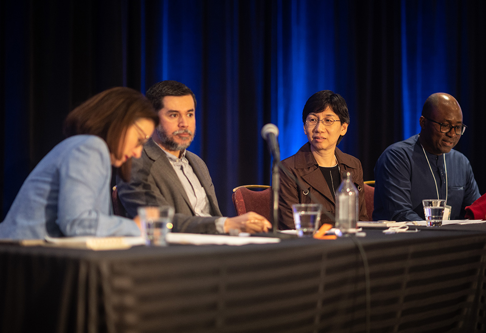 CTSA President-elect Kristin Heyer (far left) presided over a globally themed plenary session at the society’s convention, featuring panelists (from left) Leo Guardado of Fordham University, Mary Mee-Yin Yuen of Holy Spirit Seminary College of Theology and Philosophy, and Stan Chu Ilo of DePaul University. (Courtesy of Catholic Theological Society of America/Paul Schutz)