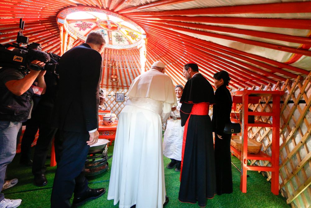 Pope Francis meets Tsetsege in a ger outside Sts. Peter and Paul Cathedral in Ulaanbaatar, Mongolia, Sept. 2. The Mongolian woman, who uses only one name, found a statue of Mary in a garbage landfill and gave it to missionaries; it is now venerated in the cathedral as Our Lady of Heaven. (CNS/Lola Gomez)