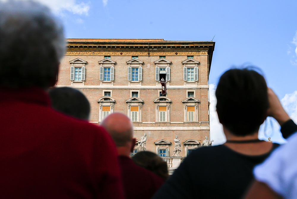 Pope Francis speaks to visitors gathered to pray the Angelus in St. Peter's Square at the Vatican Oct. 29. (CNS/Lola Gomez)