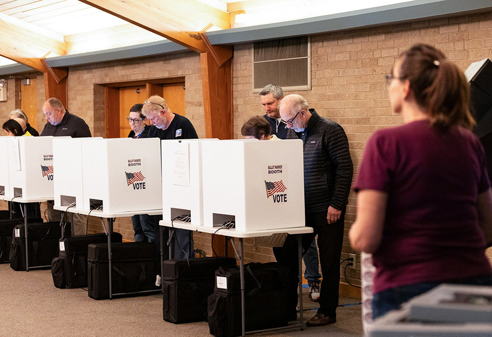 Voters fill out their ballots at a polling station in Columbus Nov. 7 as voters go to the polls in Ohio over Issue 1, a referendum on whether to enshrine expansive legal protections for abortion in the state constitution, which the state's Catholic bishops have vigorously opposed. (OSV News/Reuters/Megan Jelinger)