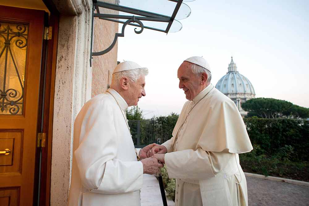 Pope Francis greets retired Pope Benedict XVI at the retired pontiff's Vatican residence Dec. 23, 2013. (OSV News/Vatican Media)