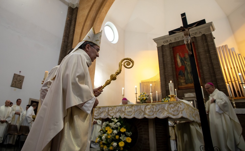 Cardinal Pierre, vested with mitre and crozier, approaches altar. 