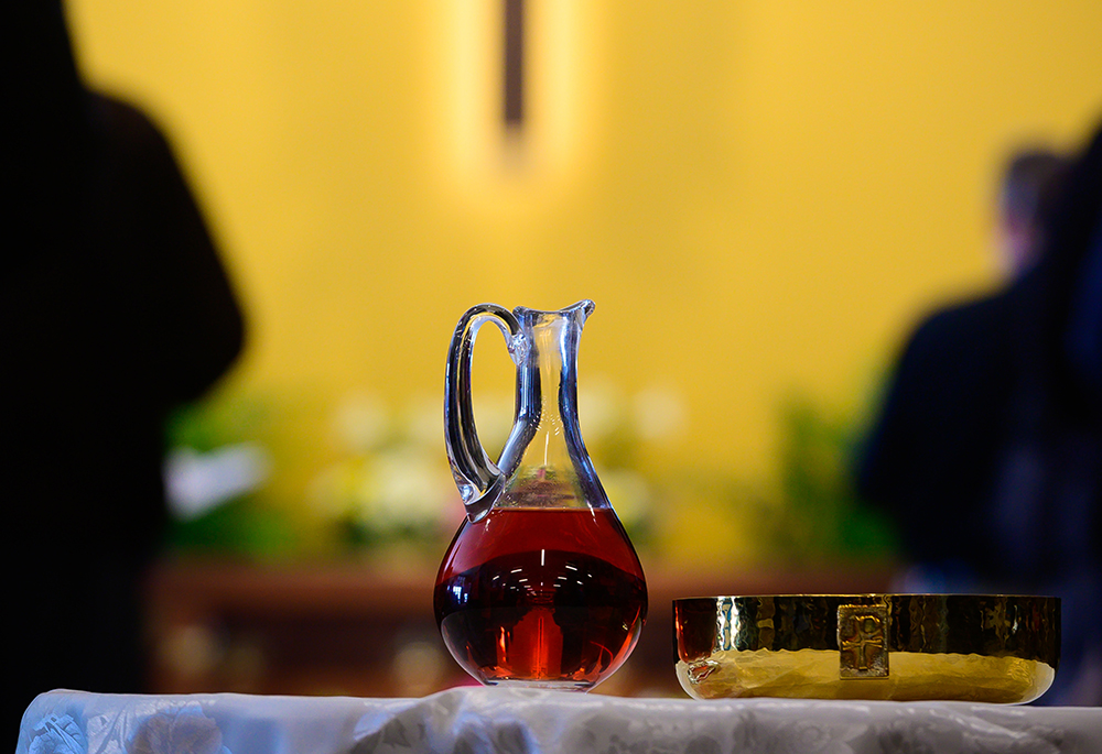A glass cruet and ciborium, holding wine and bread that will become the body and blood of Christ, sit on a table during Mass inside the Mother of Mercy Hall at the National Shrine of Our Lady of Good Help April 28, 2019, in Champion, Wisconsin. (CNS/The Compass/Sam Lucero)