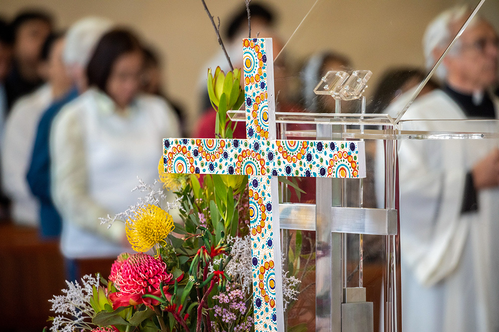 The Aboriginal Cross stands in front of the lectern for the Book of the Gospels during the opening Mass of the First Assembly of the Plenary Council at St. Mary's Cathedral in Perth, Australia, Oct. 3, 2021. (CNS/Courtesy of Perth Archdiocese/Ron Tan)