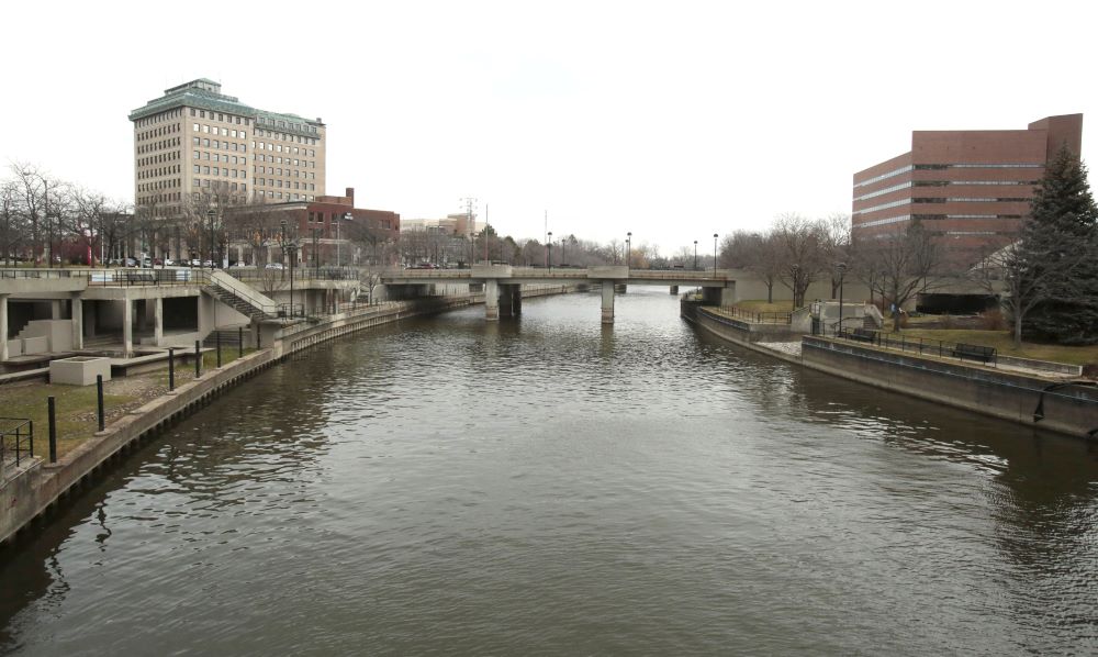 A file photo shows the Flint River flowing through downtown Flint, Mich., which continues to deal with the effects of its 2014 contaminated drinking water crisis 10 years later. Approximately 2.2 billion people worldwide (including 46 million Americans) don't have regular access to clean water -- a right Pope Francis outlined in Laudato Si'. (OSV News photo/Rebecca Cook, Reuters)