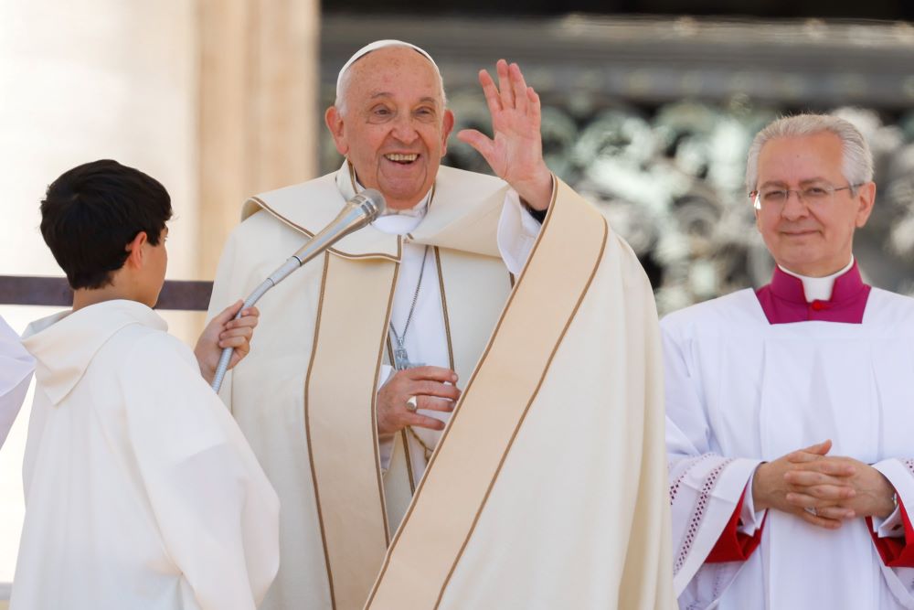 Pope Francis smiles and waves to visitors after reciting the Angelus prayer, wrapping up the first World Children's Day in St. Peter's Square at the Vatican May 26. (CNS/Lola Gomez)
