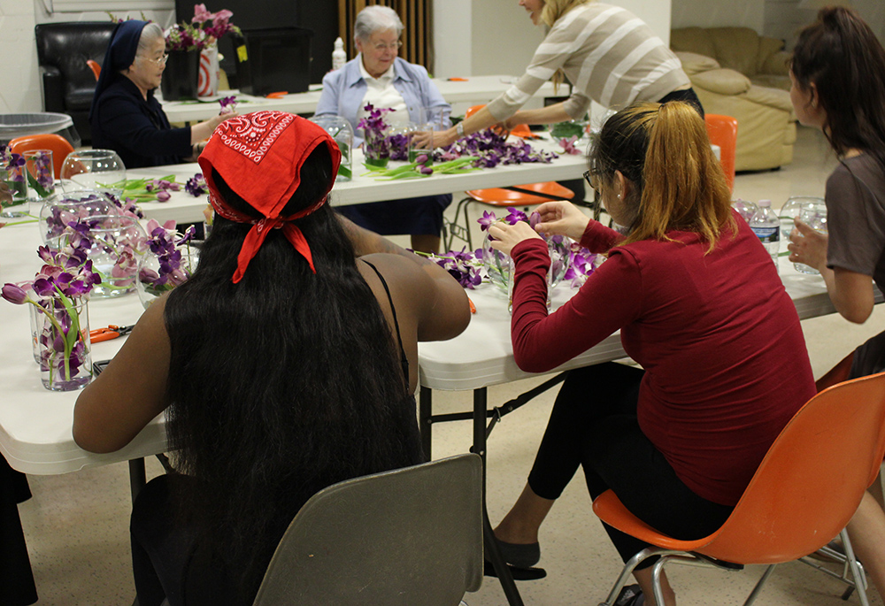 Women residing at St. Ann's Center's supportive and transitional housing programs make bouquets on Mother's Day. (Courtesy of St. Ann's Center for Children, Youth and Families)